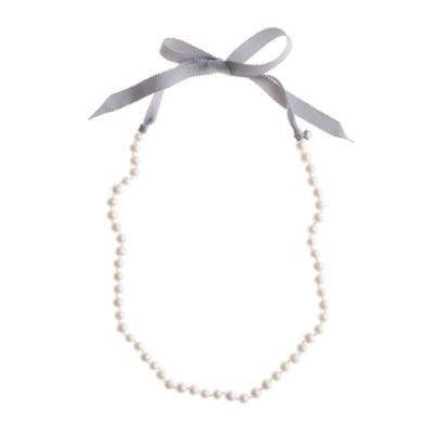 Girls' ribbon-tied long pearl necklace