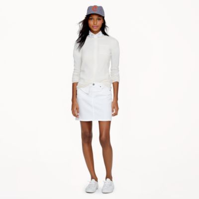 Perennially stylish, this bright white denim mini hangs off the hip 